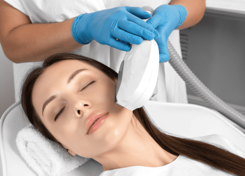 Portfolio 8 Cosmetologist holding IPL (Intense Pulsed Light) therapy Device on woman's face | Glam Bar Medical Spa in Los Angeles CA